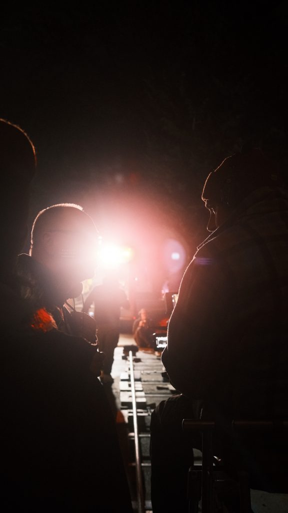 Director of Photography Bruce James Bales discusses a scene with a Director.