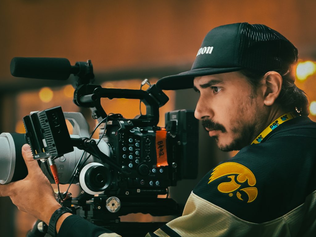 Cinematographer Bruce James Bales frames a shot up on the set of a documentary film.