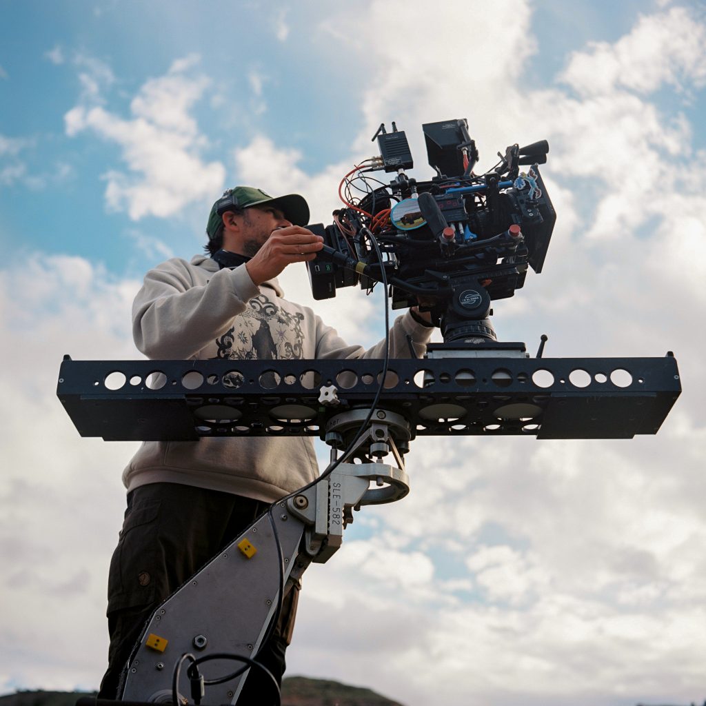 Filmmaker and Cinematographer Bruce James Bales uses a dolly and slider to frame up a shot in Nebraska on set of a feature film. 